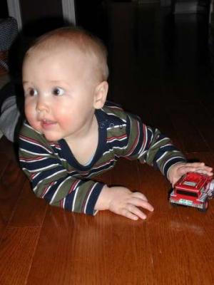 joe loves to push his fire truck around the house