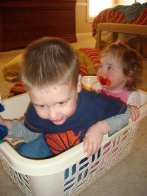 playing in the laundry basket
