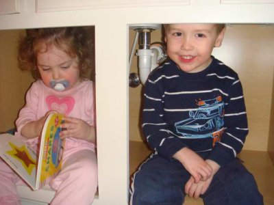 playing in the bathroom cabinets