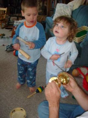 playing with the musical instruments uncle steve and uncle paul gave joe