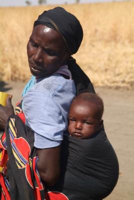 Rural Woman carrying her baby