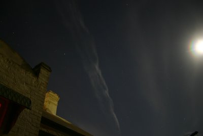 Jet vapour trail at night