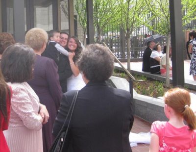 Our first view of the newlyweds (Tyler holding Boston, with Liz)