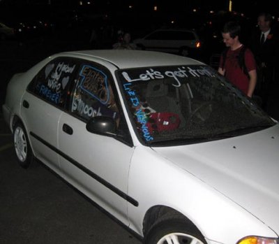 The car was decorated, even including tin cans tied to the back.