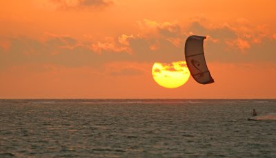 Kitesurfing at sunset