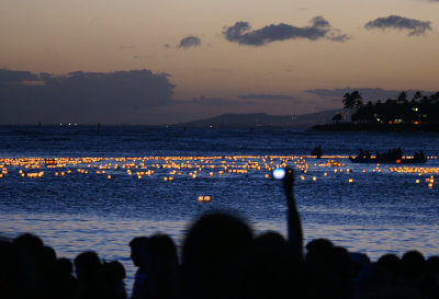 Lanterns float out to the ocean