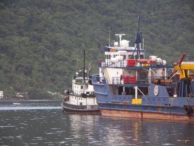 Tugboat at work in Pago harbor