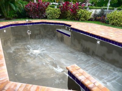 Pool with scratch coat and grouting between tiles .jpg