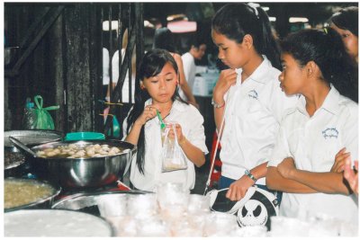 schoolchildren, Phnom Penh market