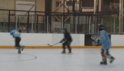 kirk clears the puck up along the boards
