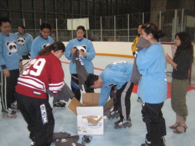 Jen passing out our winning shirts