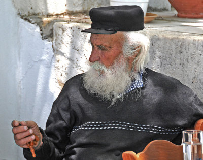 Nice Man Working with his Beads