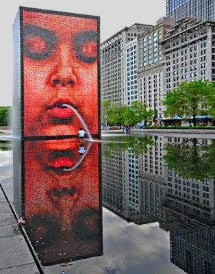 Crown Fountain, with its changeable images and unexpected pouring-water instances!  Designed by Catalan artist Jaume Plensa.