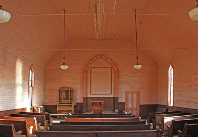 Interior of church.  Inscription:  Praise Waiteth For The Good in Zion.