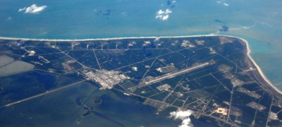 Delta Connection plane flies over Cape Canaveral in Florida