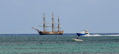 Tall-Masted Ship being observed by two small boats