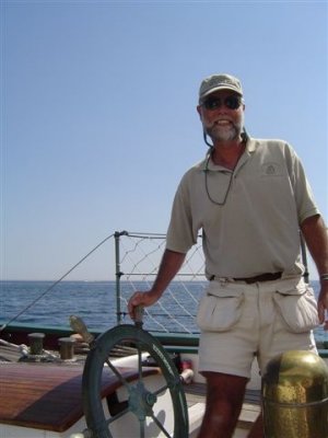 Glenn on schooner helm