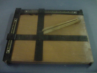 We are not sure - maybe for cutting prints for framing??   Please e-mail if you know the name for this item!