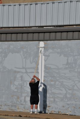 Randy rolling the very first paint on the wall