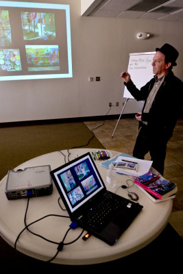 Dave showing other mural projects he has produced