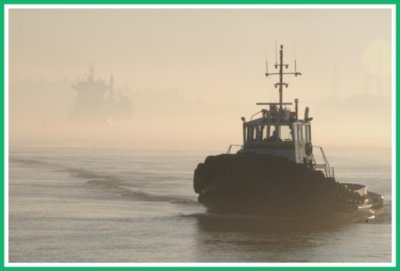 Tugboat working in the fog.