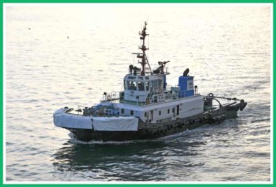 Tug with anti-scuff sheet on bow.