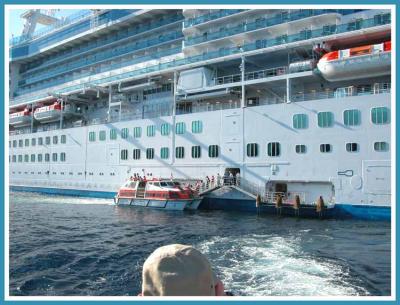 Passengers go ashore via tender.