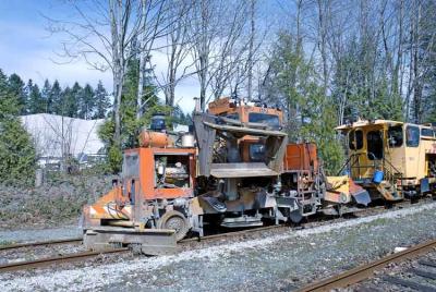 Tie tamper machine sits on a siding.