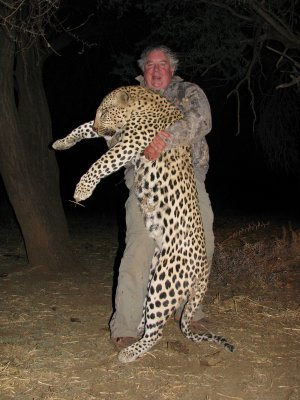 Joe had a little too much South African wine one night. He ended up wrestling this leopard to the ground!!
