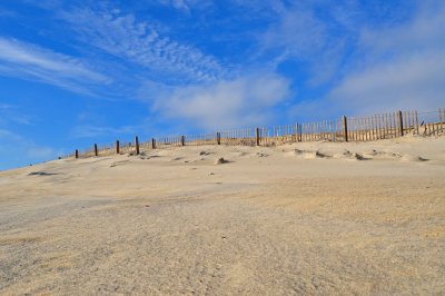 Blue skies hill top fence