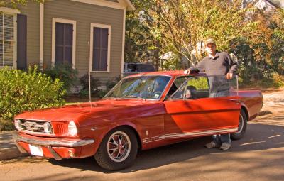 Charlie and our 1966 Mustang GT out in front of house