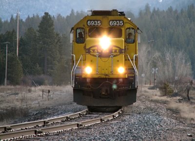 BNSF SD40-2 # 6935 and two other Santa Fe units (Dash 8, SD45-2) spotted approaching Evaro, MT. 04/07/08