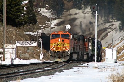 45 min. (& one large snowman later) a westbound loaded coal screams out of Mullan Tunnel. 04/07/08