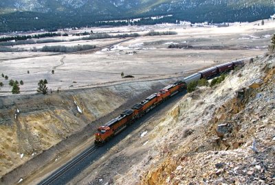 BNSF 4067, 5250, and 4135 lead 126 empty hoppers downhill around the Iron Ridge curve. 04/08/08