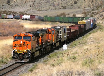 BNSF 7649 leads another eastbound manifest past the MP 190.5 signal near Toston Dam, MT. 04/09/08