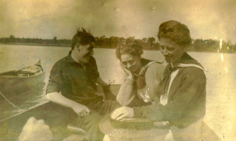 trio in boat - perhaps Muriel center & Elise Baldwin right?