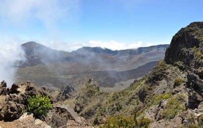 Clouds whip in and out of the crater