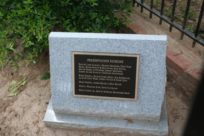 This is the new granite monument with plaque that has been added to the gravesite just inside the fence.