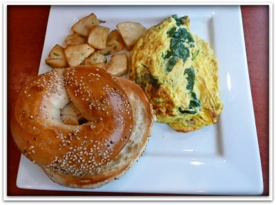 Feta and Spinach Omelette with potatoes and a bagel