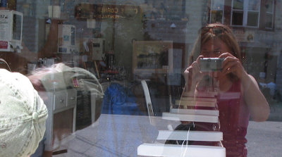 vince and sue sp's in barbershop window in frenchtown