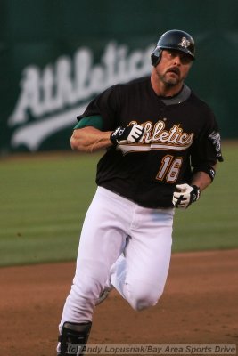Oakland Athletics DH Jason Giambi crosses third base after hitting a home run