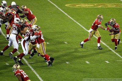 San Francisco 49ers QB Alex Smith hands off to RB Frank Gore