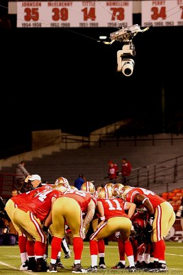 San Francisco 49ers team huddle with the Skycam watching from above