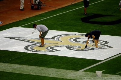 Super Bowl XLIV ground crew paints the field