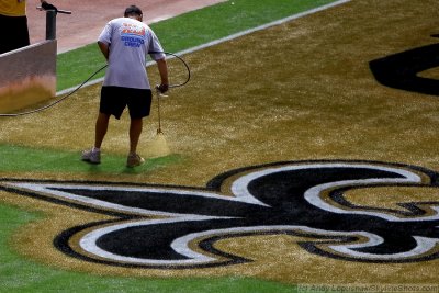 Super Bowl XLIV ground crew paints the field