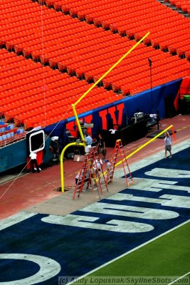 Installing the goal post in the Colts end zone