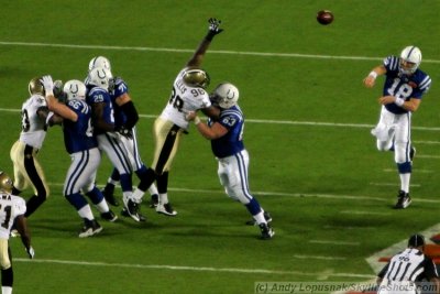 Indianapolis Colts QB Peyton Manning tosses his first pass of Super Bowl XLIV