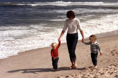 Mom and boys on beach returning