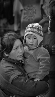 Woman and her child in the market at Pisac