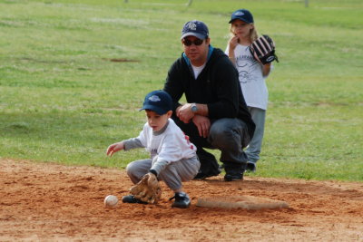 Fielding the ball and he got the runner out, too!